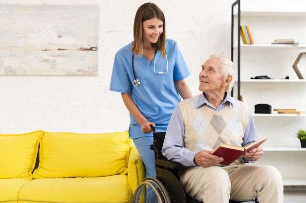 old-man-sitting-wheelchair-while-talking-nurse_23-2148239022 Care Worker